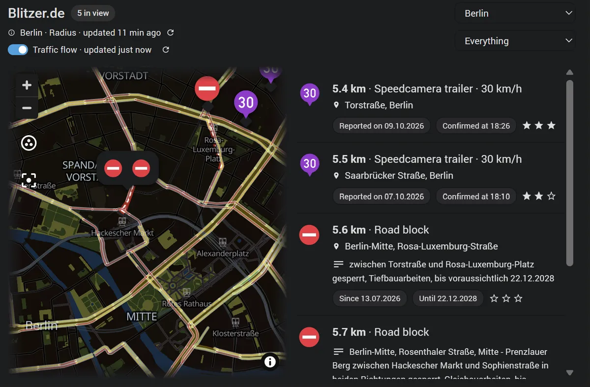 The card on an area in Berlin: two official closures drawn as red bands along the closed streets under their symbols, the list naming each one's road and its text with Since and Until chips, and the traffic flow coloured on the streets around them